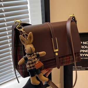 Retro brown plaid leather shoulder bag with gold clasp and cute rabbit charm accessory