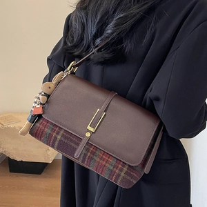 Brown leather and plaid patchwork crossbody bag with a cute rabbit pendant