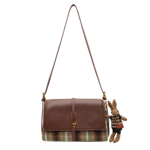 Retro plaid patchwork shoulder bag with leather accents and plush rabbit pendant