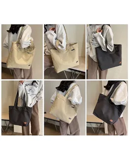 Vistas detalladas del bolso tote de lona grande en caqui y marrón oscuro para diario
