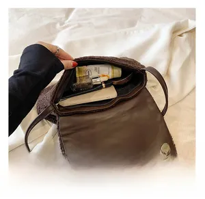 Interior view of brown sherpa shoulder bag showing spacious storage for daily items
