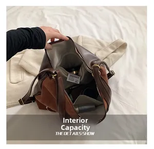 Close-up of spacious interior with herringbone lining and pockets for large capacity bag