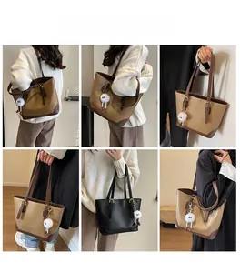 Detail showing high-capacity tote bags in black and brown with plush doll accessories