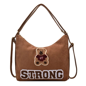 Brown frosted leather tote backpack with bear patch and STRONG lettering on white background
