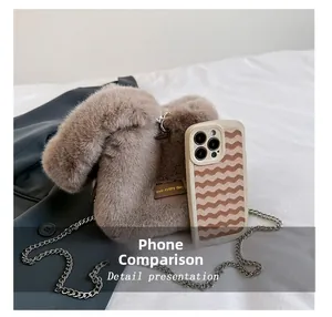 Mini plush bucket bag with chain strap compared to a smartphone for size reference