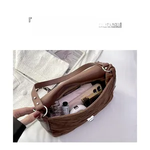 Deep brown quilted leather bag interior showing spacious storage for daily essentials
