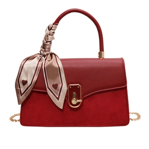 Red PU leather and suede handbag with gold chain strap and heart pattern silk scarf detail