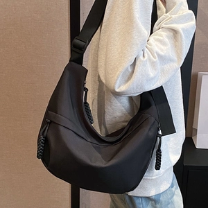 Large black nylon hobo bag for women with adjustable strap and decorative zipper puller