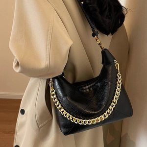 Retro black half-moon hobo bag with a chunky gold chain and adjustable shoulder strap