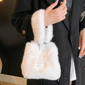 Chic white faux fur bucket bag with love every day label and metal chain strap