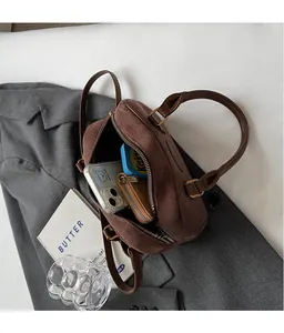 Interior view of brown matte crossbody bag showing spacious storage for essentials