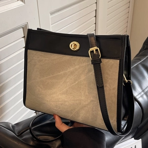 Large capacity canvas and leather tote bag with gold twist-lock and adjustable strap
