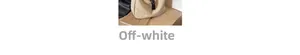 Detail of a large cream nylon crossbody bag with black braided drawstring decorations
