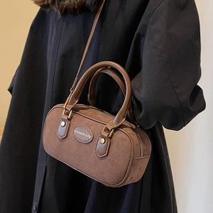 Vintage brown frosted suede Boston bag with leather handles and metallic brand plate