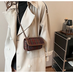 British style checkered crossbody small square bag on cream trench coat with chain strap