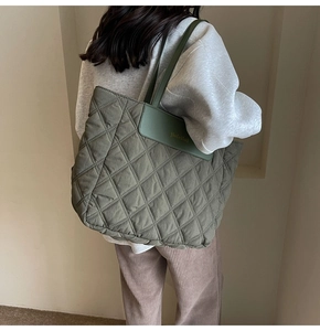Quilted olive green tote bag showing spacious design and elegant diamond stitching detail