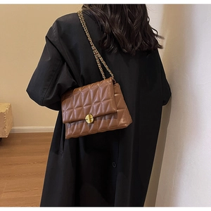Quilted diamond lattice shoulder bag in brown faux leather with gold chain strap detail