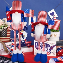 Detail of Independence Day gnomes with stars and stripes holding a flag and rocket