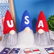 Three Independence Day patriotic gnomes with USA letters on hats for table decor