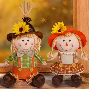 Pair of autumn scarecrow figurines with sunflowers for fall harvest home decoration