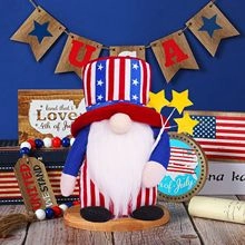 Macro detail of July 4th gnome with red white and blue patterns on festive background