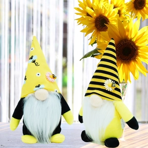 Detail of bee themed gnome plush set with sunflower decor and white daisy accents