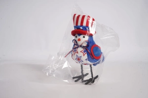 Close-up of Independence Day bird plush in gift bag with stars and stripes hat