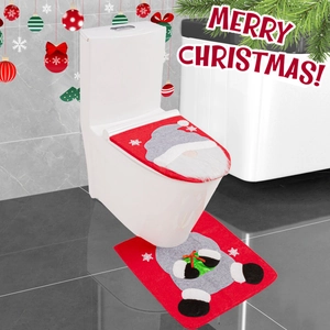 Detail view of red Christmas toilet seat cover and rug with Santa gnome and snowflake patterns
