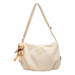 Large capacity nylon crescent bag in beige with cute teddy bear charm accessory