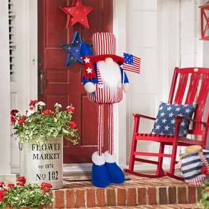 Independence Day gnome ornament with American flag elements on a festive porch