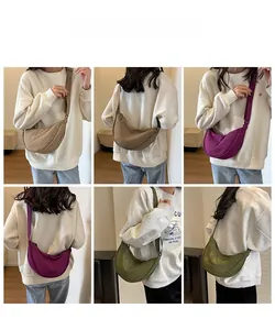 Three colors of slouchy crescent cross-body bags shown on a model for scale and style