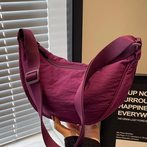 Chic purple crescent crossbody bag in pleated nylon fabric with adjustable shoulder strap