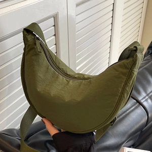 Olive green crescent nylon shoulder bag with adjustable strap and wrinkled texture finish