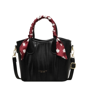 Elegant black PU leather handbag with wine red silk scarf handle and golden hardware