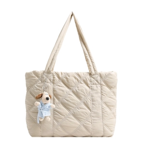 Beige quilted nylon tote bag with rhombus pattern and cute plush puppy charm
