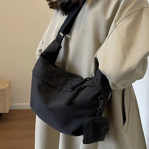 Large capacity black nylon crossbody bag with small pouch and adjustable shoulder strap