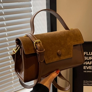Retro brown faux leather and suede shoulder bag with gold metal hardware and top handle