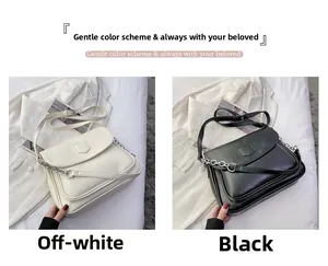 Detailed view of off-white and black vintage PU leather crossbody bags with metal chains