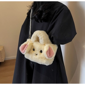 Detail showing plush rabbit bag with soft faux fur texture and elegant pearl shoulder strap