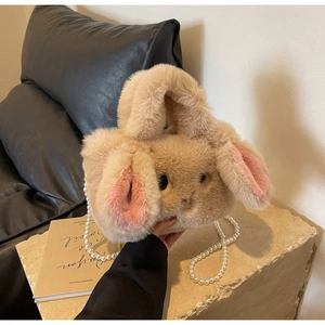 Detail of plush rabbit bag showing soft faux fur texture and elegant pearl shoulder strap
