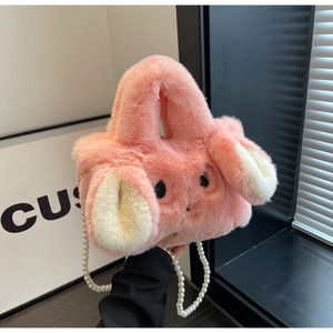 Close-up of soft pink plush bunny handbag featuring fluffy texture and pearl chain strap