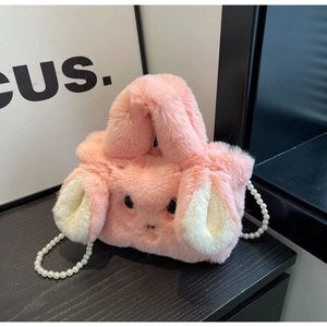 Detail of pink faux fur rabbit bag featuring soft texture and pearl bead chain strap