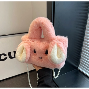 Detail view of pink plush bunny bag with soft fur texture and elegant pearl chain strap