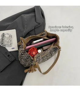 Macro view of spacious interior of tweed tote bag showing large storage capacity