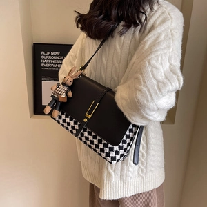 Women's checkerboard tote bag with black leather flap and cute rabbit charm