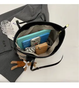 Top view of spacious black tote bag interior showing large capacity for essentials
