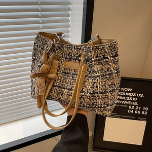 Chic tweed tote bag for women with leather handles and a cute bunny charm pendant