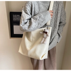 Off-white large capacity tote bag with knitted bear pendant and wide shoulder strap