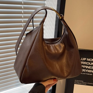 Brown vintage faux leather hobo tote bag with wide shoulder strap and gold hardware