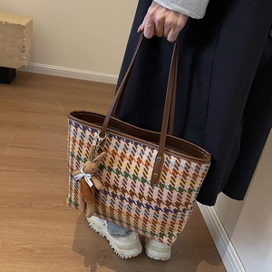 Chic houndstooth pattern large tote bag with brown leather handles and plush bunny charm